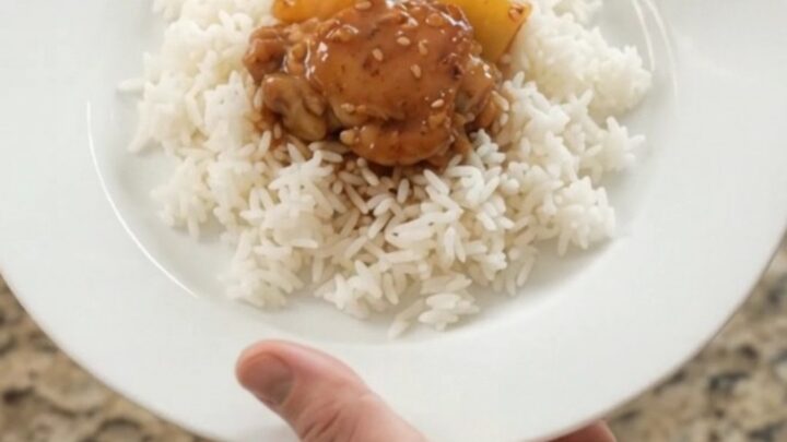 Caramelized chicken thighs and pineapple in a slow cooker with teriyaki glaze