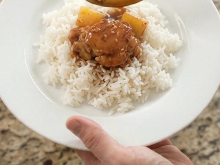Caramelized chicken thighs and pineapple in a slow cooker with teriyaki glaze