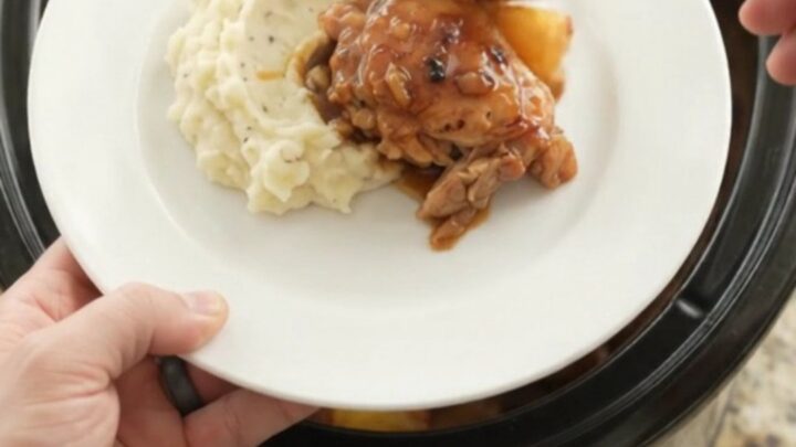 Slow cooker pineapple bourbon glazed chicken thighs, caramelized and glossy