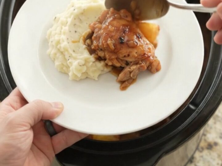 Slow cooker pineapple bourbon glazed chicken thighs, caramelized and glossy
