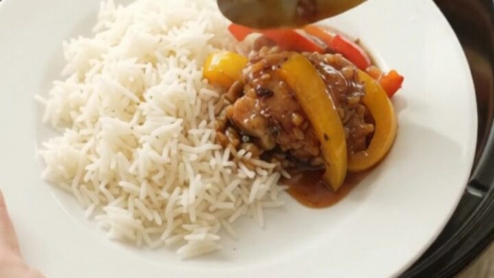 Slow cooker honey soy chicken thighs with bell peppers, glistening in a sticky sauce