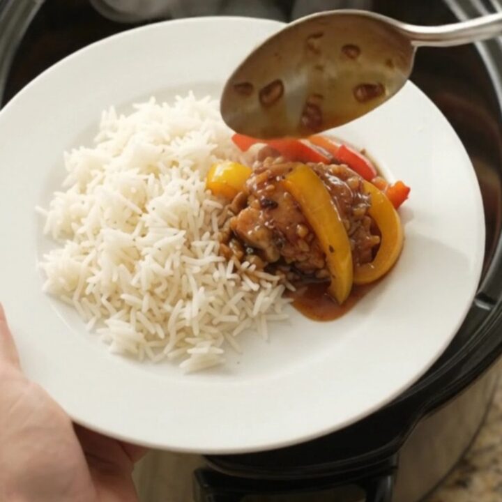 Slow cooker honey soy chicken thighs with bell peppers, glistening in a sticky sauce