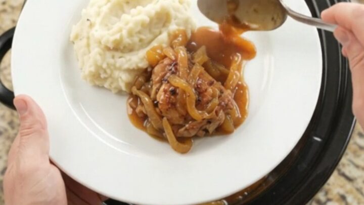 Glazed chicken thighs in slow cooker with apricot and bourbon sauce