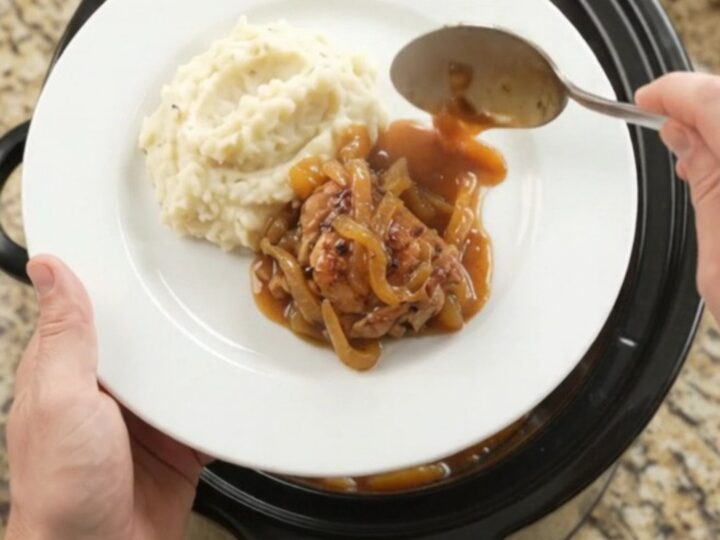 Glazed chicken thighs in slow cooker with apricot and bourbon sauce