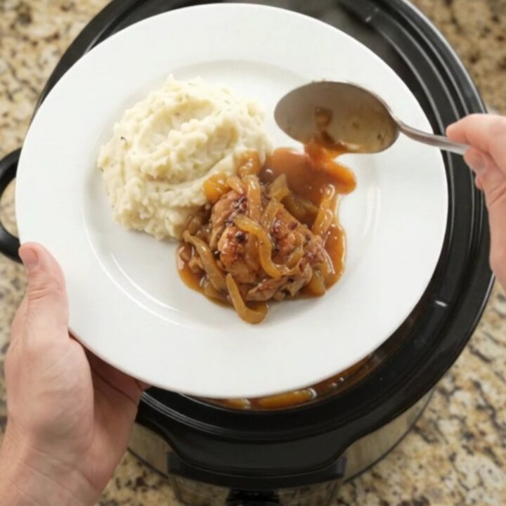 Glazed chicken thighs in slow cooker with apricot and bourbon sauce
