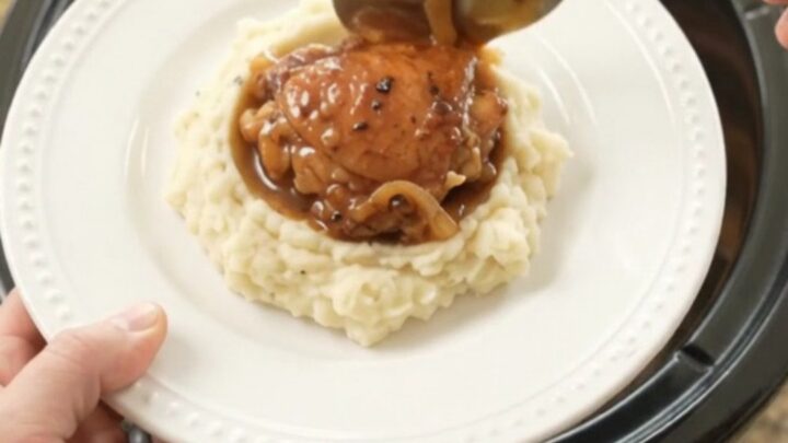 Caramelized bourbon glazed chicken thighs with Vidalia onions in a slow cooker