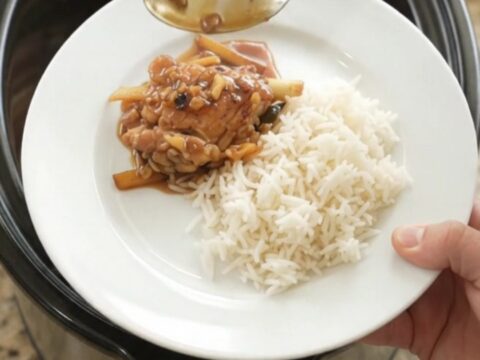 Slow cooker chicken thighs in a glossy honey-soy glaze with ginger and scallions