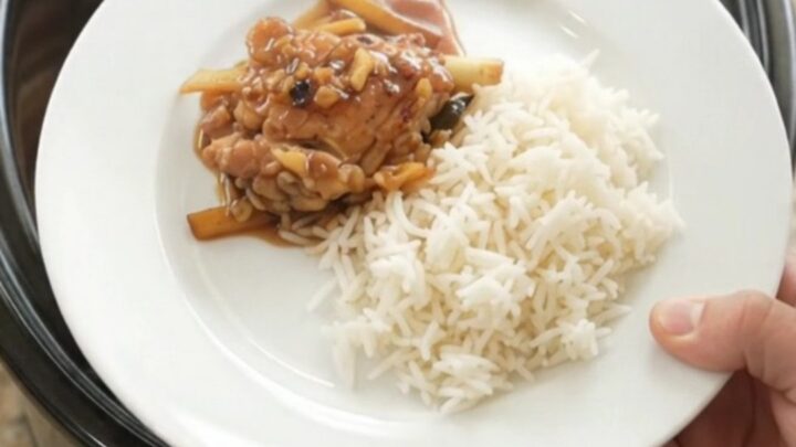 Slow cooker chicken thighs in a glossy honey-soy glaze with ginger and scallions