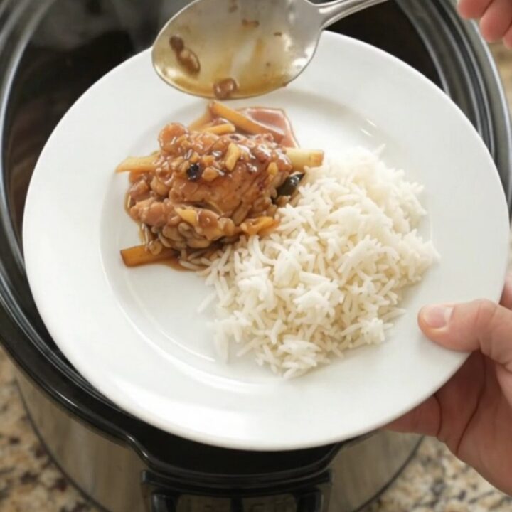 Slow cooker chicken thighs in a glossy honey-soy glaze with ginger and scallions