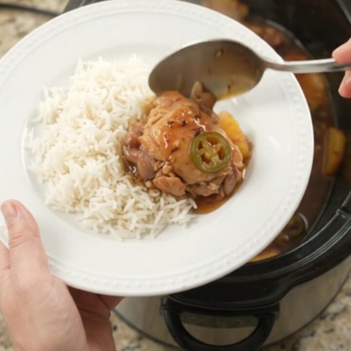 Slow cooker chicken thighs with pineapple and jalapeños in a sticky honey-soy glaze