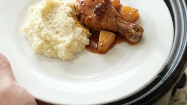 Glazed chicken drumsticks with caramelized pineapple in a slow cooker, glossy bourbon sauce