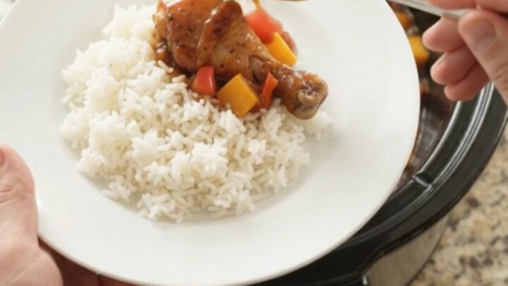 Slow cooker chicken drumsticks with mango and red bell pepper in hickory BBQ sauce, glistening and tender