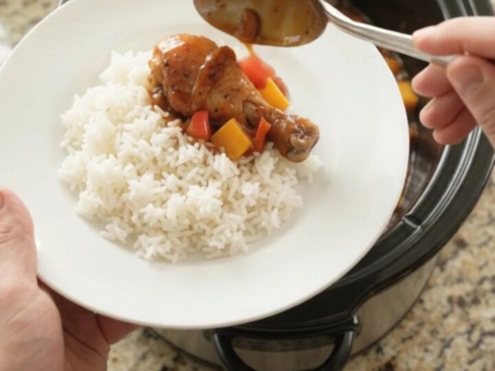 Slow cooker chicken drumsticks with mango and red bell pepper in hickory BBQ sauce, glistening and tender