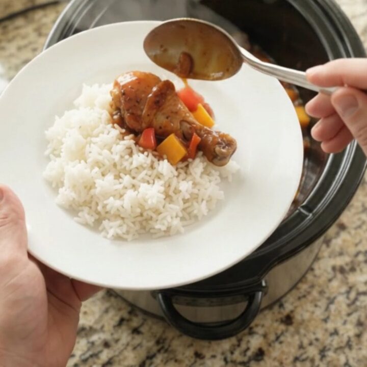 Slow cooker chicken drumsticks with mango and red bell pepper in hickory BBQ sauce, glistening and tender