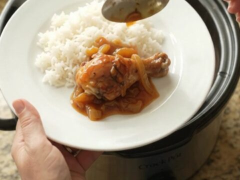 Glazed chicken drumsticks in a slow cooker with apricot and BBQ sauce