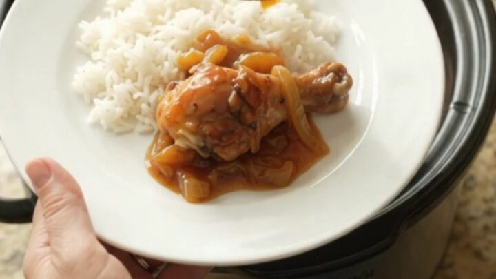 Glazed chicken drumsticks in a slow cooker with apricot and BBQ sauce