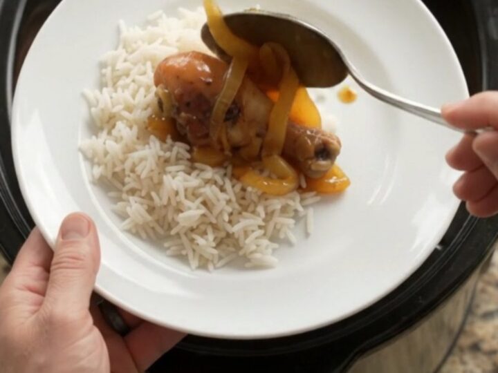 Glazed chicken drumsticks in a slow cooker with apricot onion sauce