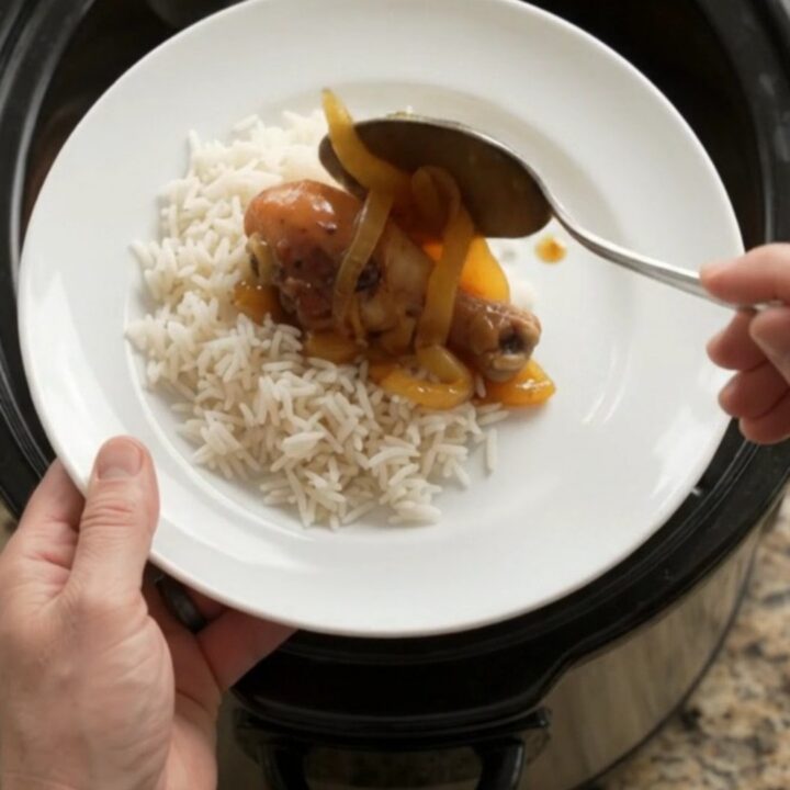Glazed chicken drumsticks in a slow cooker with apricot onion sauce