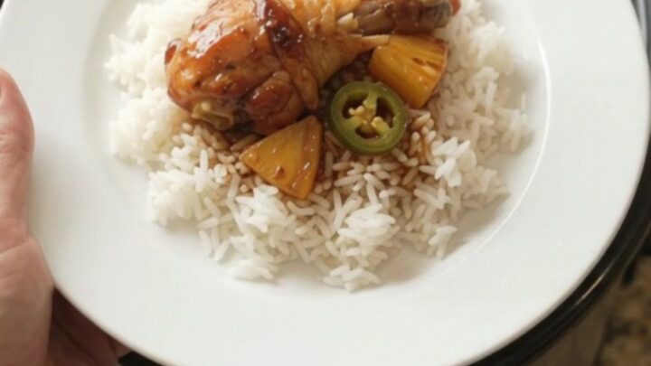 Glazed chicken drumsticks with pineapple and jalapeños in a slow cooker