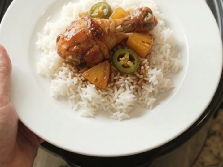 Glazed chicken drumsticks with pineapple and jalapeños in a slow cooker