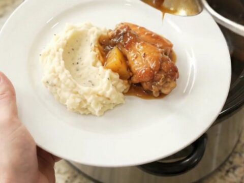 Sticky pineapple bourbon BBQ chicken wings in a slow cooker, glazed and caramelized