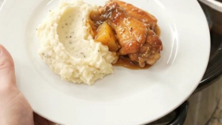 Sticky pineapple bourbon BBQ chicken wings in a slow cooker, glazed and caramelized