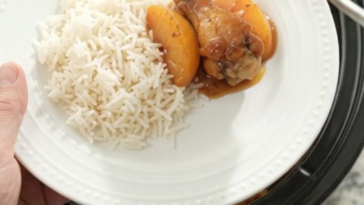 Sticky peach honey soy chicken wings in a slow cooker, glistening with sauce