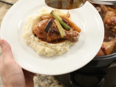 Glazed chicken drumsticks in a slow cooker with ginger and scallions