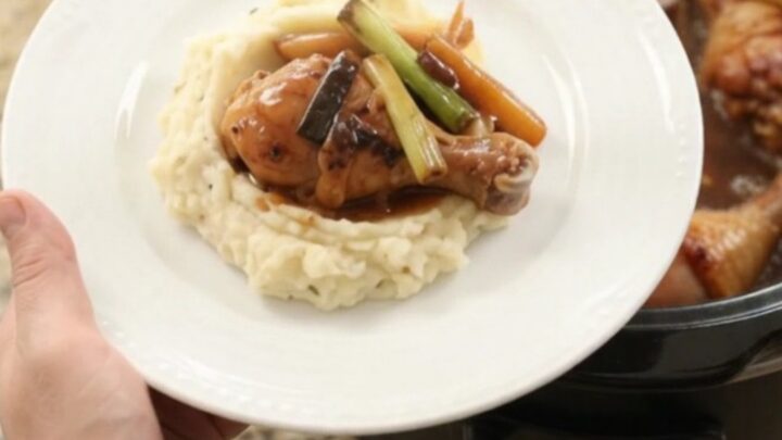 Glazed chicken drumsticks in a slow cooker with ginger and scallions