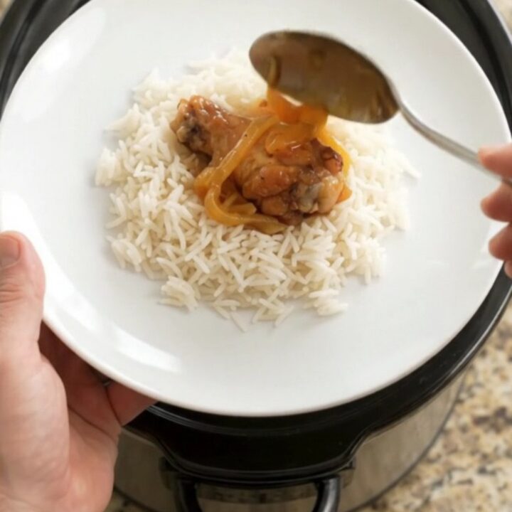 Sticky apricot honey soy chicken wings in a slow cooker with glossy glaze and steam rising