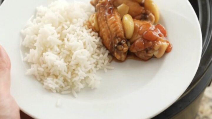 Slow cooker chicken wings in glossy hickory BBQ sauce with garlic and scallions