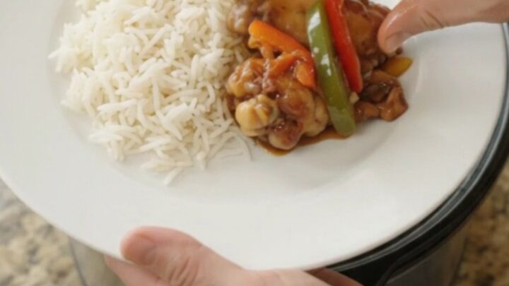 Sticky honey soy chicken wings with bell peppers in a slow cooker, glazed and glossy