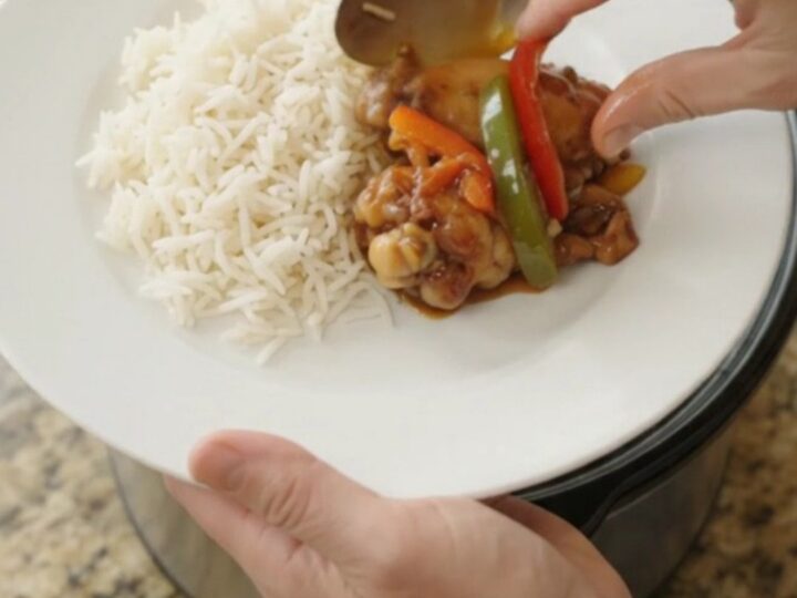 Sticky honey soy chicken wings with bell peppers in a slow cooker, glazed and glossy