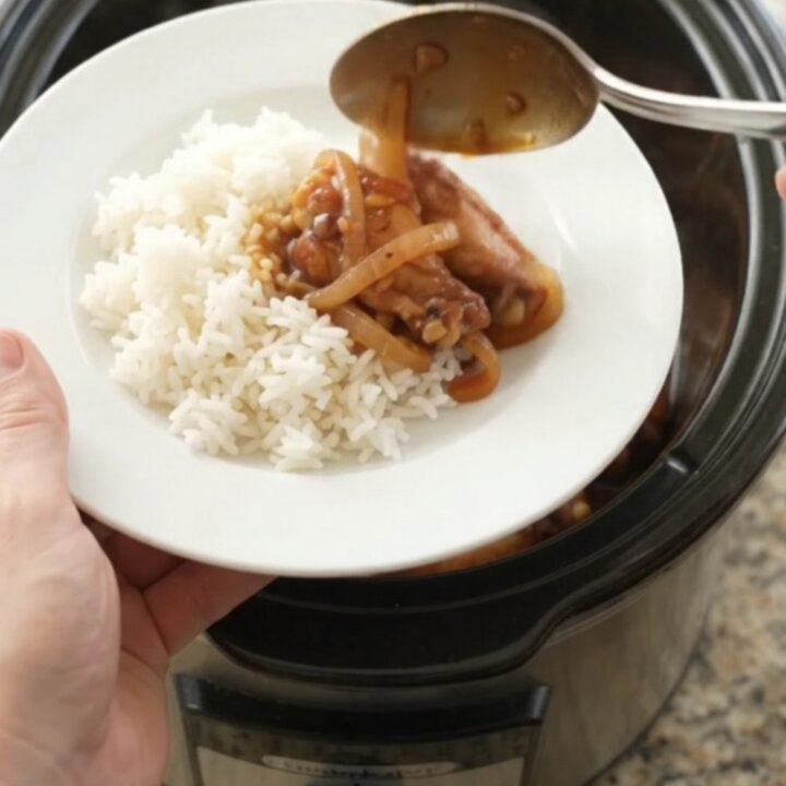 Slow-cooker BBQ chicken wings with caramelized Vidalia onions in a glossy hickory sauce