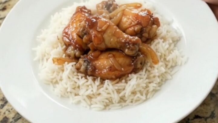 Sticky honey soy chicken wings with caramelized onions in a slow cooker