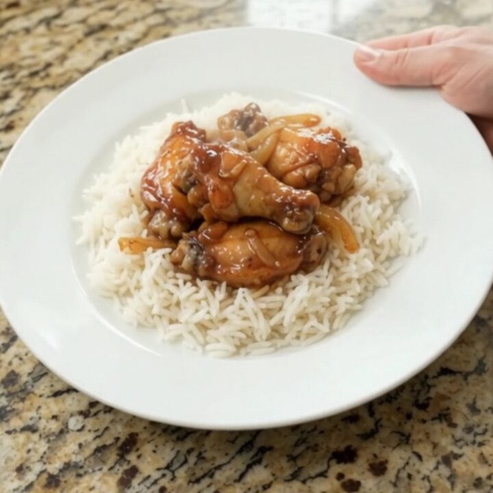 Sticky honey soy chicken wings with caramelized onions in a slow cooker