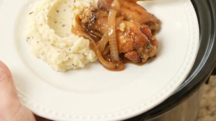 Sticky bourbon-glazed chicken wings with caramelized Vidalia onions in a slow cooker