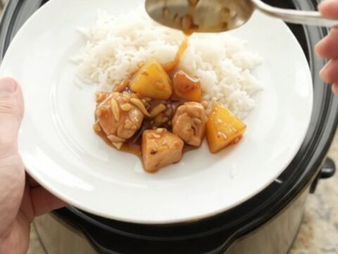 Glazed chicken and pineapple in a slow cooker with a glossy honey-soy sauce