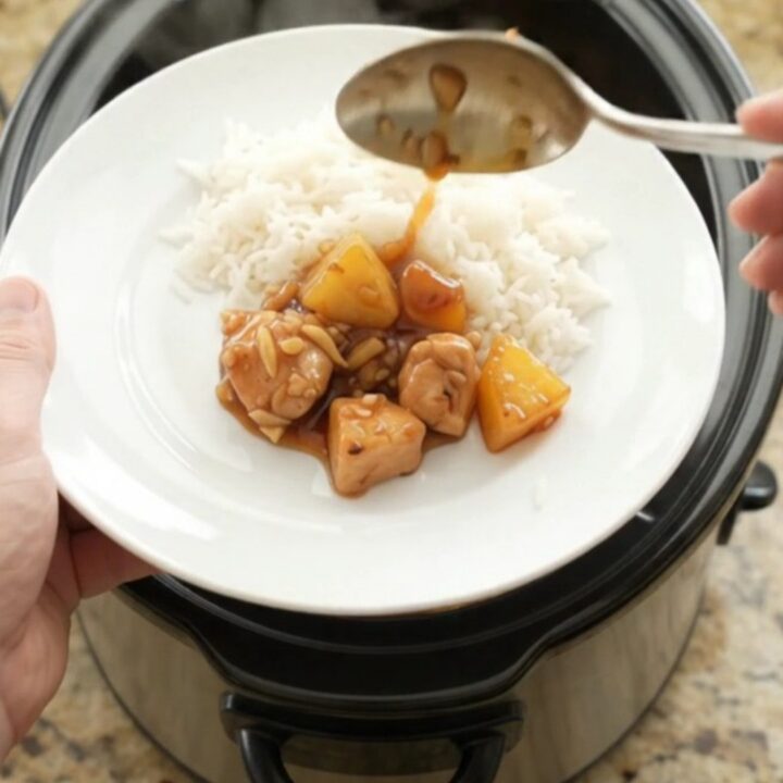 Glazed chicken and pineapple in a slow cooker with a glossy honey-soy sauce