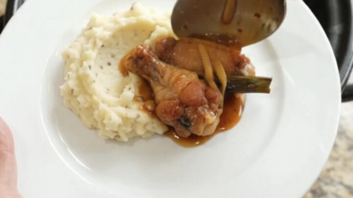 Sticky bourbon glazed chicken wings in a slow cooker with ginger and scallions