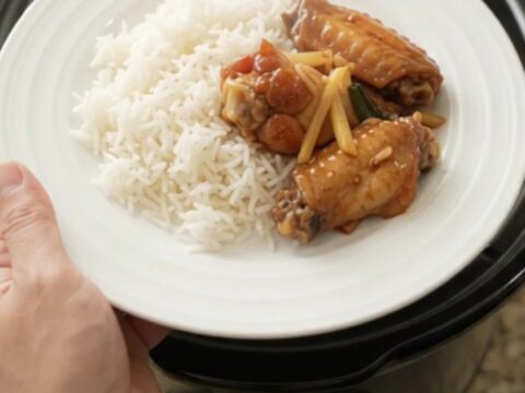 Sticky honey soy chicken wings in a slow cooker with ginger and scallions