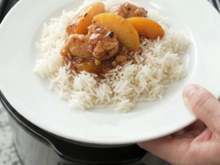 Slow cooker chicken and peaches in a glossy honey-soy sauce, served over rice