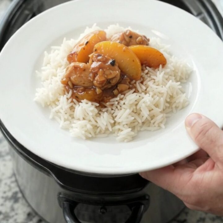 Slow cooker chicken and peaches in a glossy honey-soy sauce, served over rice