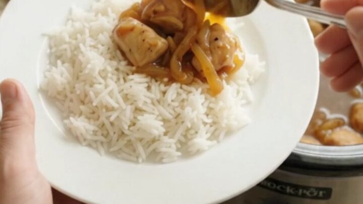 Glazed chicken bites in a slow cooker with apricot-onion ribbons and a sticky amber sauce