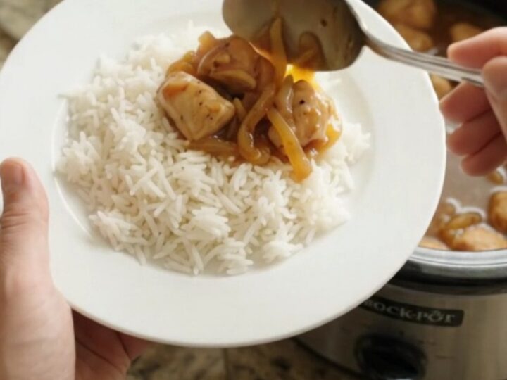 Glazed chicken bites in a slow cooker with apricot-onion ribbons and a sticky amber sauce