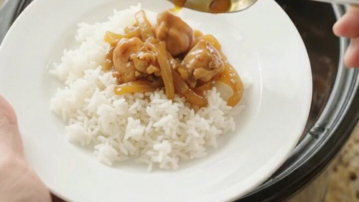 Glazed apricot hickory BBQ chicken bites in a slow cooker, glossy and steaming