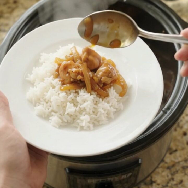 Glazed apricot hickory BBQ chicken bites in a slow cooker, glossy and steaming