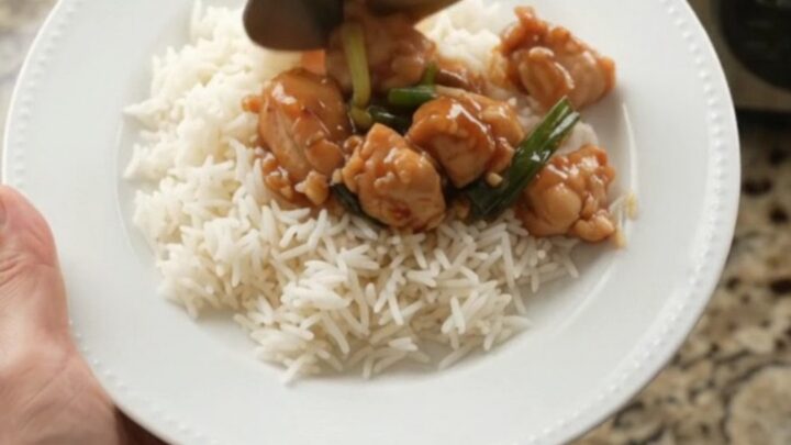 Glazed chicken bites with ginger and scallions in a slow cooker
