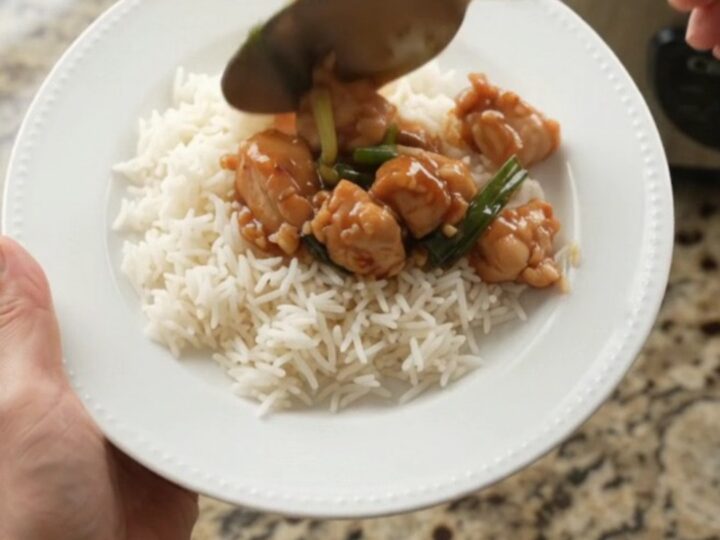 Glazed chicken bites with ginger and scallions in a slow cooker