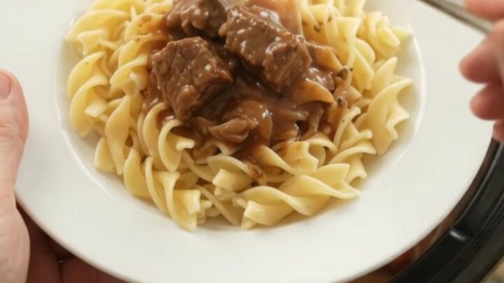 Sour Cream Pepper Beef Bites in a slow cooker, with tender beef and peppers in a creamy gravy